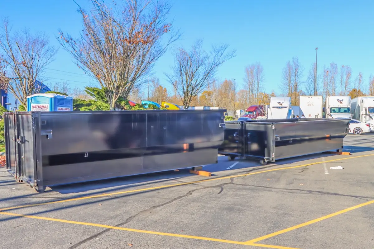 Professional dumpster rental service with roll-off container on residential driveway in Cazenovia